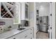 Butler's pantry with wine storage, coffee bar, and additional counter space at 4001 Ainsley Ave, Orlando, FL 32833