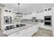 Modern kitchen with a large island, white cabinets, and high-end stainless steel appliances at 4001 Ainsley Ave, Orlando, FL 32833