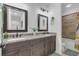 Elegant bathroom with double vanity and granite countertop at 4001 Ainsley Ave, Orlando, FL 32833