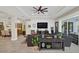 Gathering room with sectional sofa, fireplace, and access to the backyard and pool at 4001 Ainsley Ave, Orlando, FL 32833