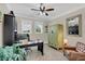 Bright home office features built-in shelving and a large desk at 4001 Ainsley Ave, Orlando, FL 32833