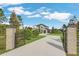 Two-story house with gated entrance and landscaping at 4001 Ainsley Ave, Orlando, FL 32833