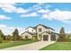 Two-story home with gray stone and white accents at 4001 Ainsley Ave, Orlando, FL 32833