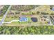 Bird's-eye view of a house, expansive lot, and pond at 4001 Ainsley Ave, Orlando, FL 32833