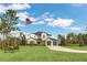 Two-story house with a three-car garage, and landscaping at 4001 Ainsley Ave, Orlando, FL 32833