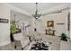 Cozy sitting area furnished with armchairs, a cowhide rug, and a chandelier at 4001 Ainsley Ave, Orlando, FL 32833