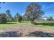 Open pasture with a view of the home in the distance at 4001 Ainsley Ave, Orlando, FL 32833