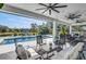 Relaxing pool area with lounge chairs and patio furniture at 4001 Ainsley Ave, Orlando, FL 32833