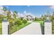 Two-story home with a long driveway and gated entry at 4001 Ainsley Ave, Orlando, FL 32833
