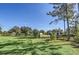 Spacious backyard with a shed and wooden fence at 4001 Ainsley Ave, Orlando, FL 32833