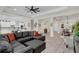 Open and airy Gathering room with a sectional sofa, and views to the kitchen and dining area at 4001 Ainsley Ave, Orlando, FL 32833