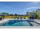 Relaxing pool area with patio furniture and hot tub at 4001 Ainsley Ave, Orlando, FL 32833