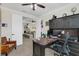 Spacious home office with desk and view into adjacent living area at 4001 Ainsley Ave, Orlando, FL 32833