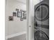 Modern laundry room with stackable washer and dryer at 4001 Ainsley Ave, Orlando, FL 32833