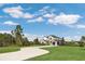 Two-story house with a curved driveway and landscaped lawn at 4001 Ainsley Ave, Orlando, FL 32833