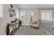 Spacious loft area with seating and a view to the living room below at 4001 Ainsley Ave, Orlando, FL 32833