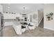 Open kitchen features a large island with seating, white cabinetry, and stainless steel appliances at 4001 Ainsley Ave, Orlando, FL 32833