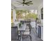 Outdoor kitchen with built-in grill, seating, and granite countertops at 4001 Ainsley Ave, Orlando, FL 32833