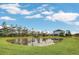 Large pond and a shed in the backyard of a house at 4001 Ainsley Ave, Orlando, FL 32833