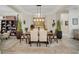Elegant dining room with a large wooden table and neutral-toned chairs at 4001 Ainsley Ave, Orlando, FL 32833