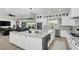 Open concept kitchen with large island, breakfast bar, and views into the living area at 4001 Ainsley Ave, Orlando, FL 32833