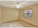 Well-lit bedroom featuring a ceiling fan and window with blinds at 2709 Canterclub Trl, Apopka, FL 32712