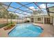 Inviting screened-in pool with concrete decking at 2709 Canterclub Trl, Apopka, FL 32712