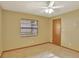 Charming bedroom with ceiling fan and window looking out to backyard at 2709 Canterclub Trl, Apopka, FL 32712