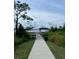 Lakeside community pier with gazebo and walkway at 7247 Rolling Leaf Rd, Groveland, FL 34736