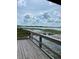 Scenic view of a lake from a wooden deck, perfect for relaxing at 7247 Rolling Leaf Rd, Groveland, FL 34736