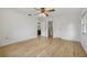 Large bedroom with light wood flooring and ceiling fan at 33629 Wesley Rd, Eustis, FL 32736