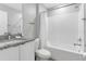 Clean bathroom with shower/tub combo, granite vanity, and white subway tile at 7960 Formosa Valley Pl, Kissimmee, FL 34747