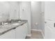 Clean bathroom with granite countertop, single sink, and toilet at 7960 Formosa Valley Pl, Kissimmee, FL 34747