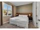 Spacious bedroom with king-size bed and large window at 7960 Formosa Valley Pl, Kissimmee, FL 34747