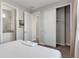 Bright bedroom with a queen bed, ensuite bathroom access, and a spacious closet at 7960 Formosa Valley Pl, Kissimmee, FL 34747