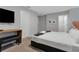 Bright bedroom with queen-size bed and a TV at 7960 Formosa Valley Pl, Kissimmee, FL 34747