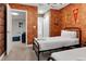 Two twin beds in a charming bedroom with a brick feature wall at 7960 Formosa Valley Pl, Kissimmee, FL 34747