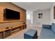 Entertainment area featuring large TV and built-in media console at 7960 Formosa Valley Pl, Kissimmee, FL 34747