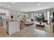 Open concept living space with kitchen, dining, and living areas at 7960 Formosa Valley Pl, Kissimmee, FL 34747