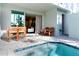 Relaxing pool area with patio furniture and view into living area at 7960 Formosa Valley Pl, Kissimmee, FL 34747