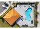 Community pool with adjacent covered patio and lounge chairs at 7960 Formosa Valley Pl, Kissimmee, FL 34747
