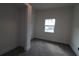 Small bedroom with a window and new carpet at 828 Willie Mays Pkwy, Orlando, FL 32811
