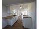 Modern kitchen with white cabinets and butcher block countertops at 828 Willie Mays Pkwy, Orlando, FL 32811