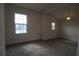 Bright bedroom with new carpet and large window at 828 Willie Mays Pkwy, Orlando, FL 32811