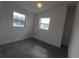 Bright bedroom with two windows and new carpet at 828 Willie Mays Pkwy, Orlando, FL 32811