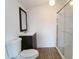 Clean bathroom with a walk-in shower and dark vanity at 828 Willie Mays Pkwy, Orlando, FL 32811