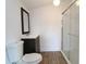 Clean bathroom with a walk-in shower and dark vanity at 828 Willie Mays Pkwy, Orlando, FL 32811