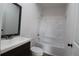 Clean bathroom, featuring a tub and updated vanity at 828 Willie Mays Pkwy, Orlando, FL 32811