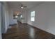 Spacious living area with hardwood floors and kitchen view at 828 Willie Mays Pkwy, Orlando, FL 32811