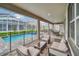 Screened patio with pool, spa, and lounge chairs at 730 Drop Shot Dr, Davenport, FL 33896